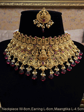 Load image into Gallery viewer, Broad green and ruby drops laxmiji choker set with intricate peacock motifs