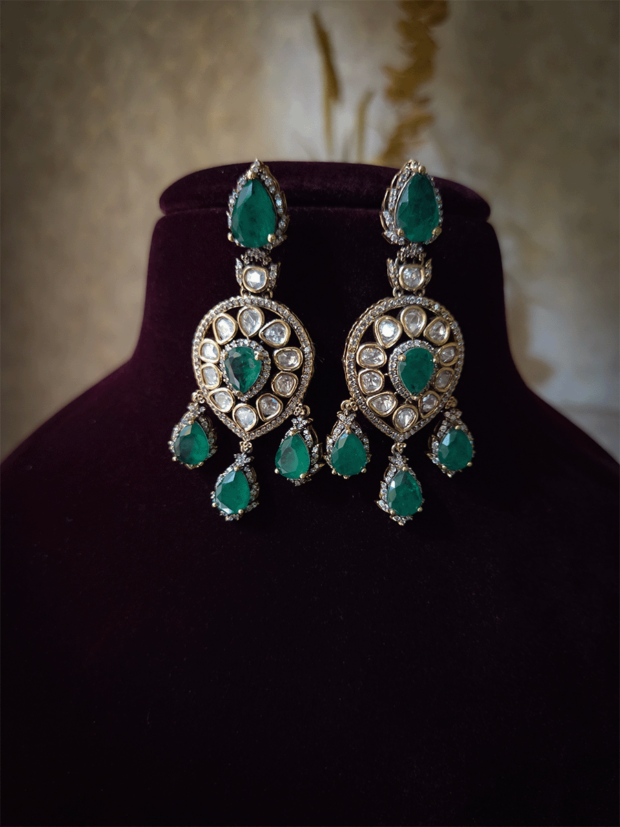 Moissanite set with connecting moissanite tukdies with green tear drop stones set