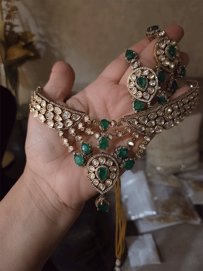 Moissanite set with connecting moissanite tukdies with green tear drop stones set