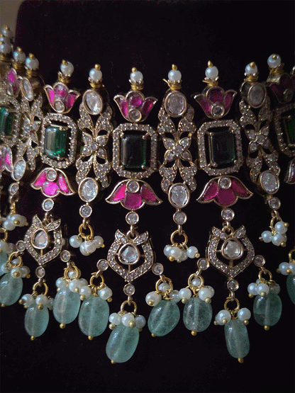 Rectangular green stones with hanging moissanite tukdies and ruby flower design antique gold finish set