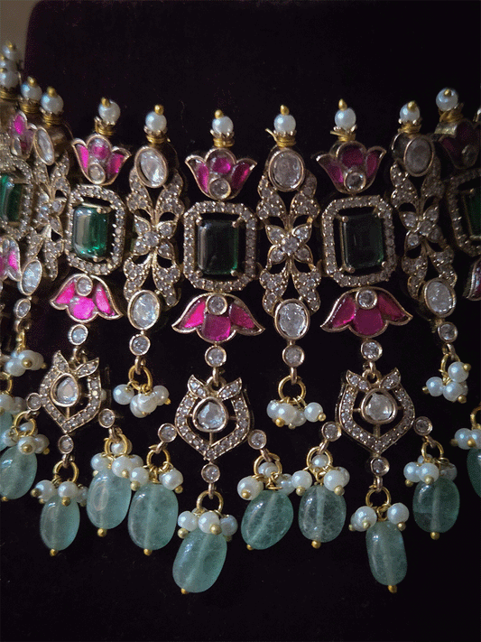 Rectangular green stones with hanging moissanite tukdies and ruby flower design antique gold finish set