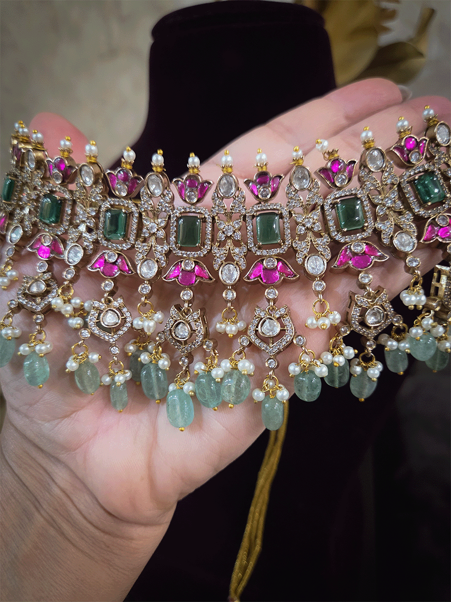 Rectangular green stones with hanging moissanite tukdies and ruby flower design antique gold finish set
