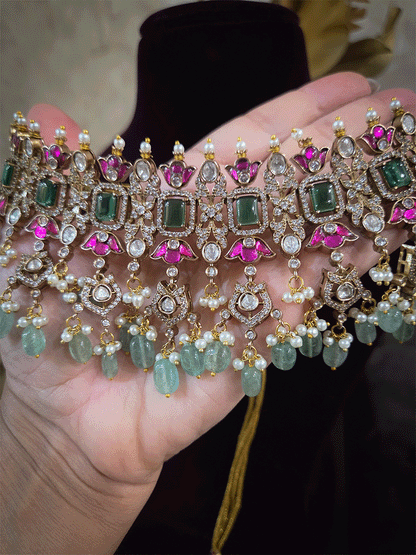 Rectangular green stones with hanging moissanite tukdies and ruby flower design antique gold finish set
