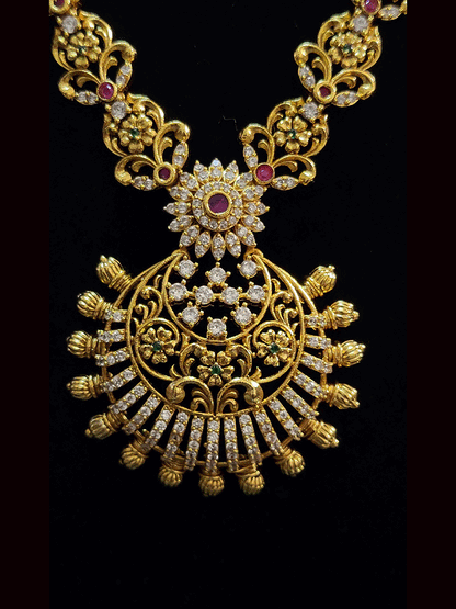 Long round pendant with flower design AD,green and ruby stones studded set