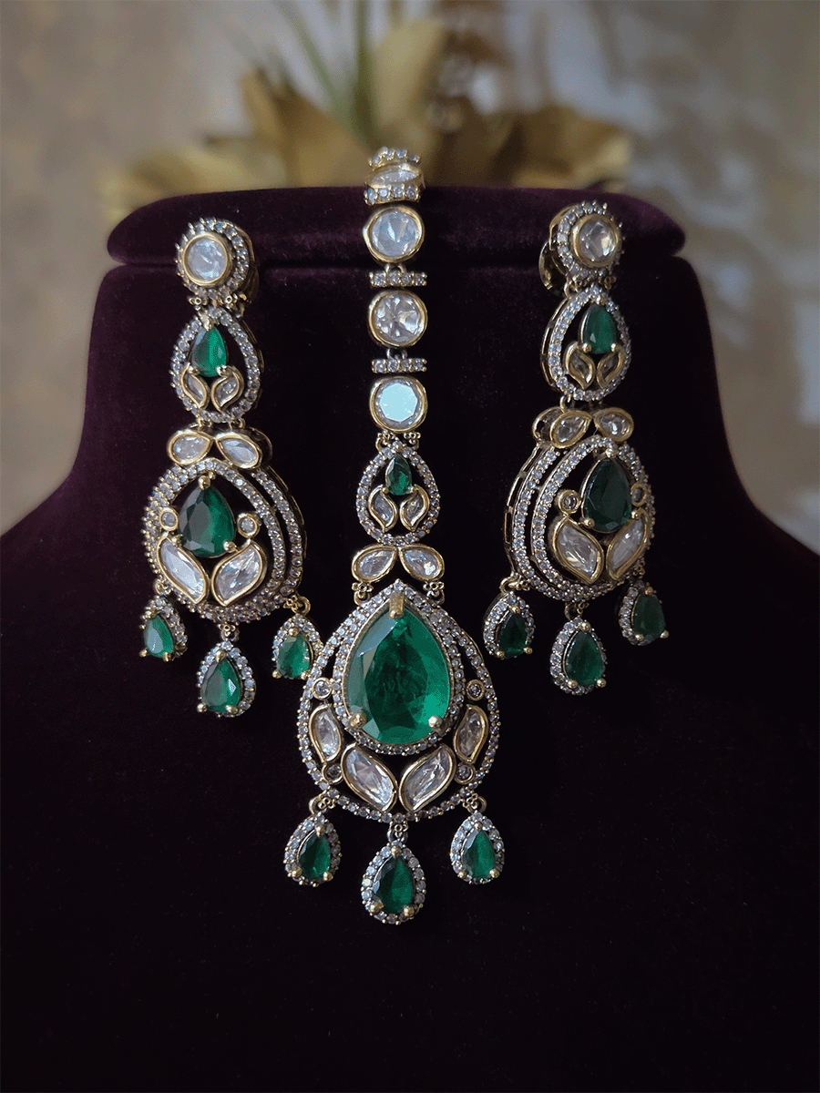 Green stones studded triple layer moissanite set with green tear drop hanging