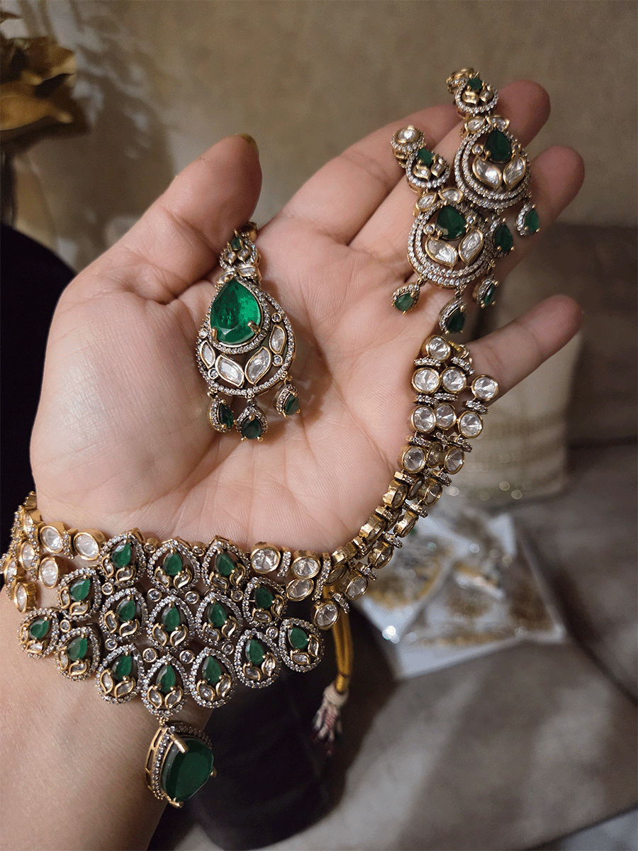 Green stones studded triple layer moissanite set with green tear drop hanging