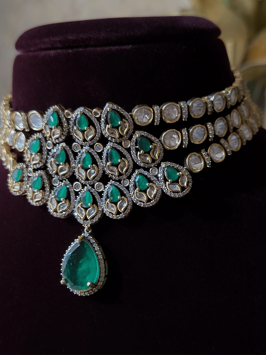 Green stones studded triple layer moissanite set with green tear drop hanging