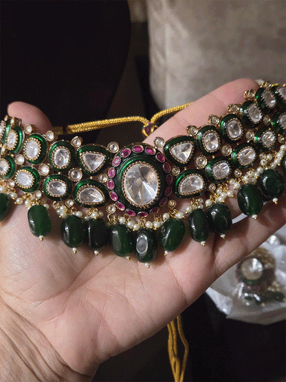 Bold oval uncut polki in center of green enamel choker set with green hanging beads