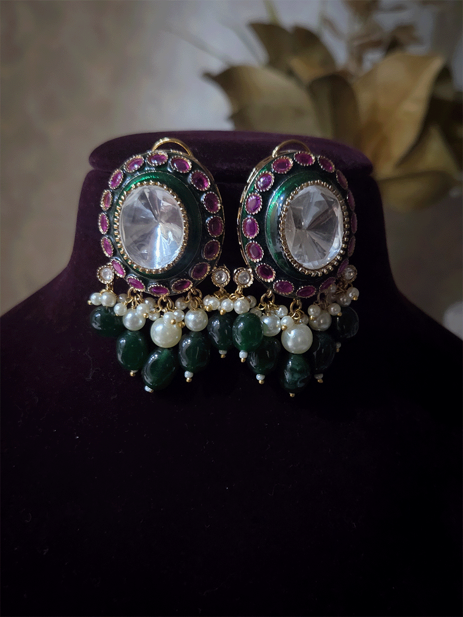 Bold oval uncut polki in center of green enamel choker set with green hanging beads