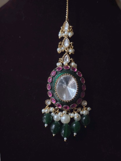 Bold oval uncut polki in center of green enamel choker set with green hanging beads