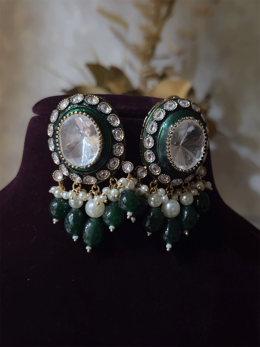Bold oval uncut polki in center of green enamel choker set with green hanging beads