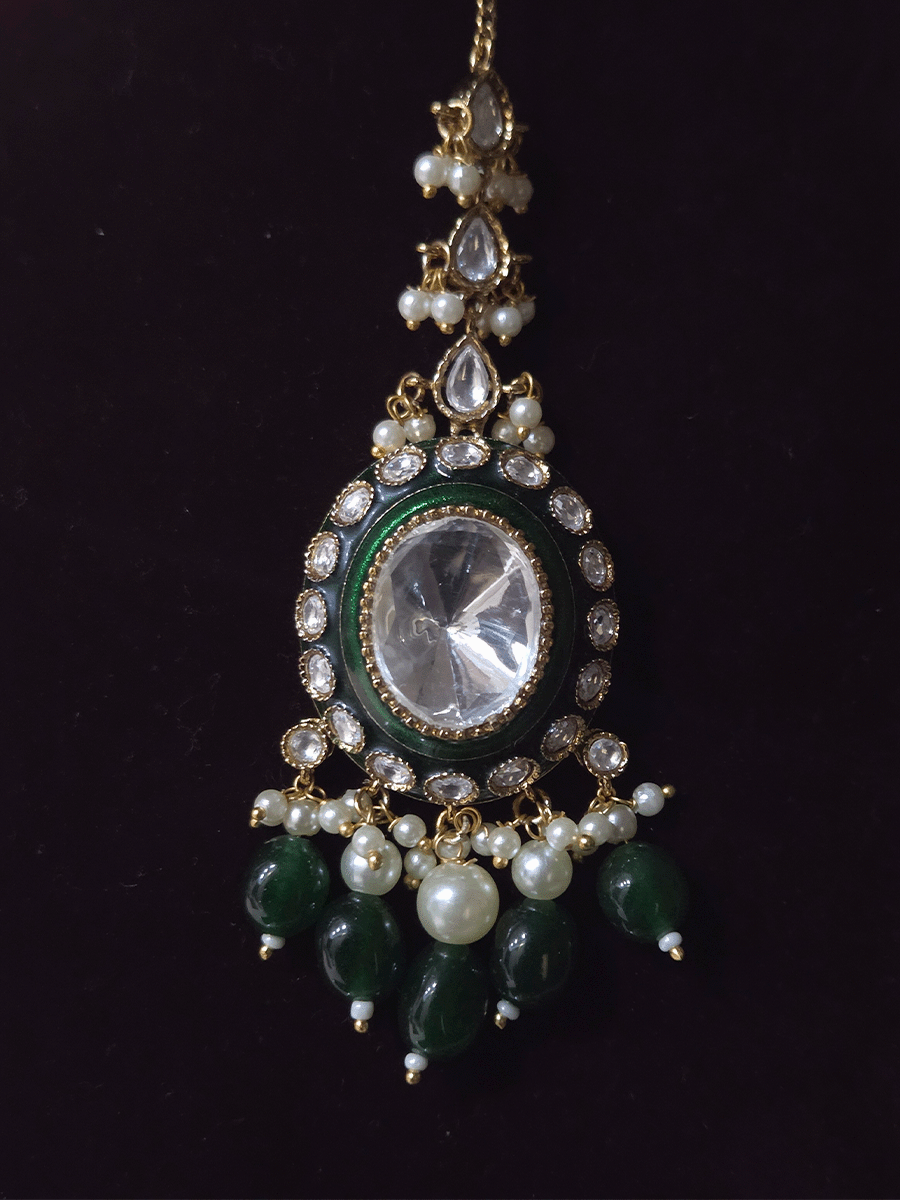 Bold oval uncut polki in center of green enamel choker set with green hanging beads