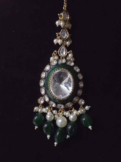 Bold oval uncut polki in center of green enamel choker set with green hanging beads