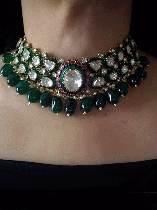 Bold oval uncut polki in center of green enamel choker set with green hanging beads