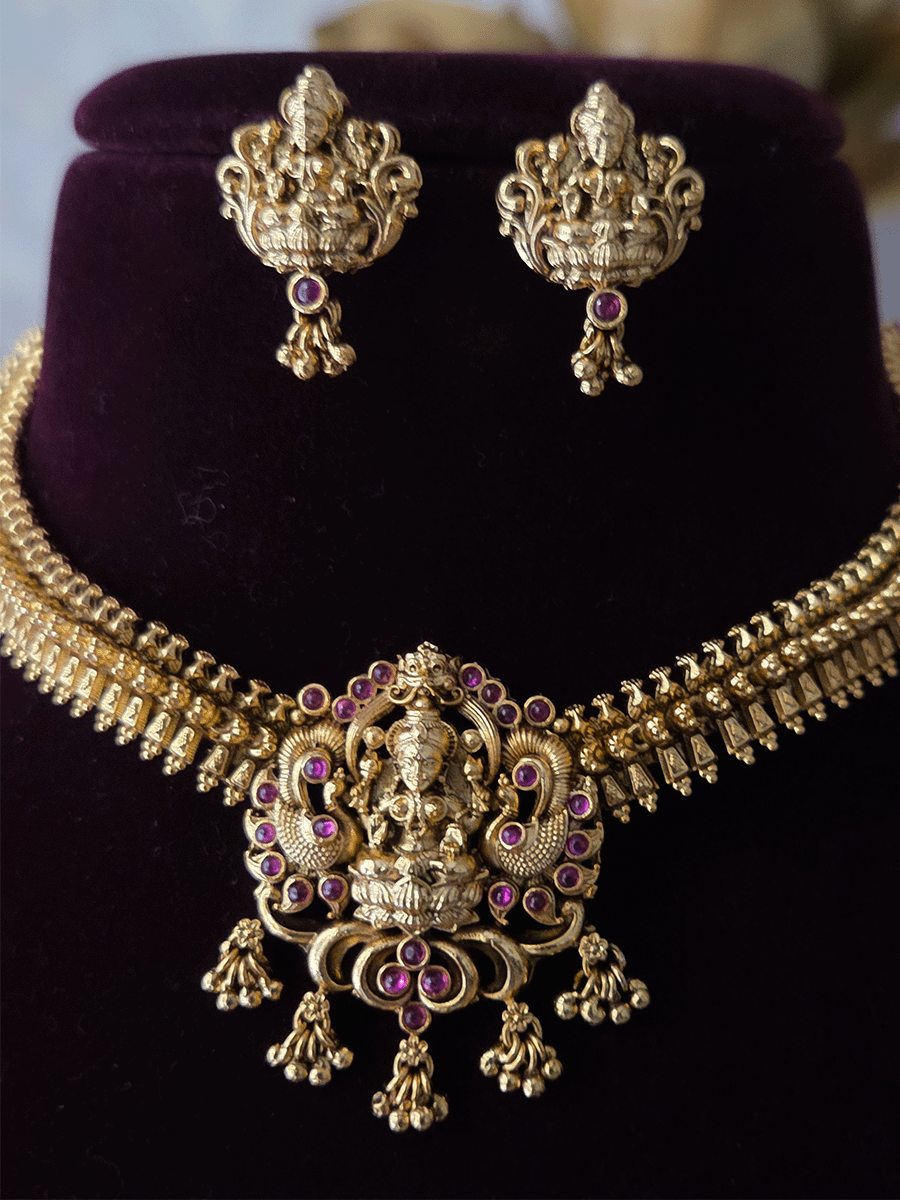 Ruby stones studded laxmiji motif set with side classy design chain