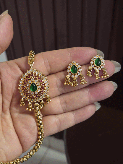 Thick self design gold chain with leaf design ghunghru hanging side brooch set