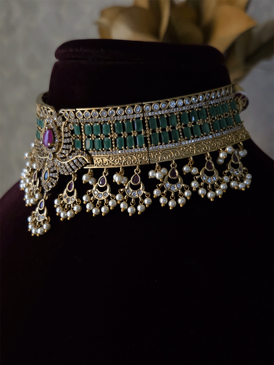 Rectangular stones setting in classy polki and AD set with leaf tukdi hangings