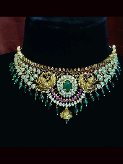 Oval green stone center and peacocks on both sides polki set with green drops