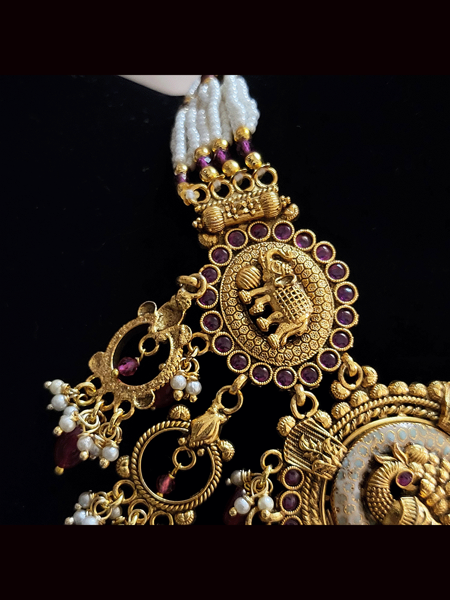 Oval mint enamel tukdies with peacock and elephant motifs ruby drops set
