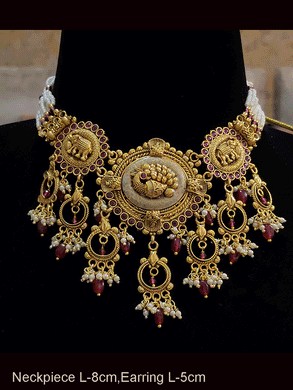Oval mint enamel tukdies with peacock and elephant motifs ruby drops set