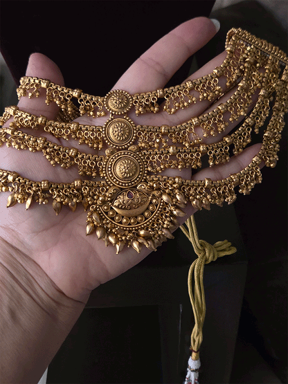 Four layer ghunghru hangings with center circular and half moon design set with leaf hangings