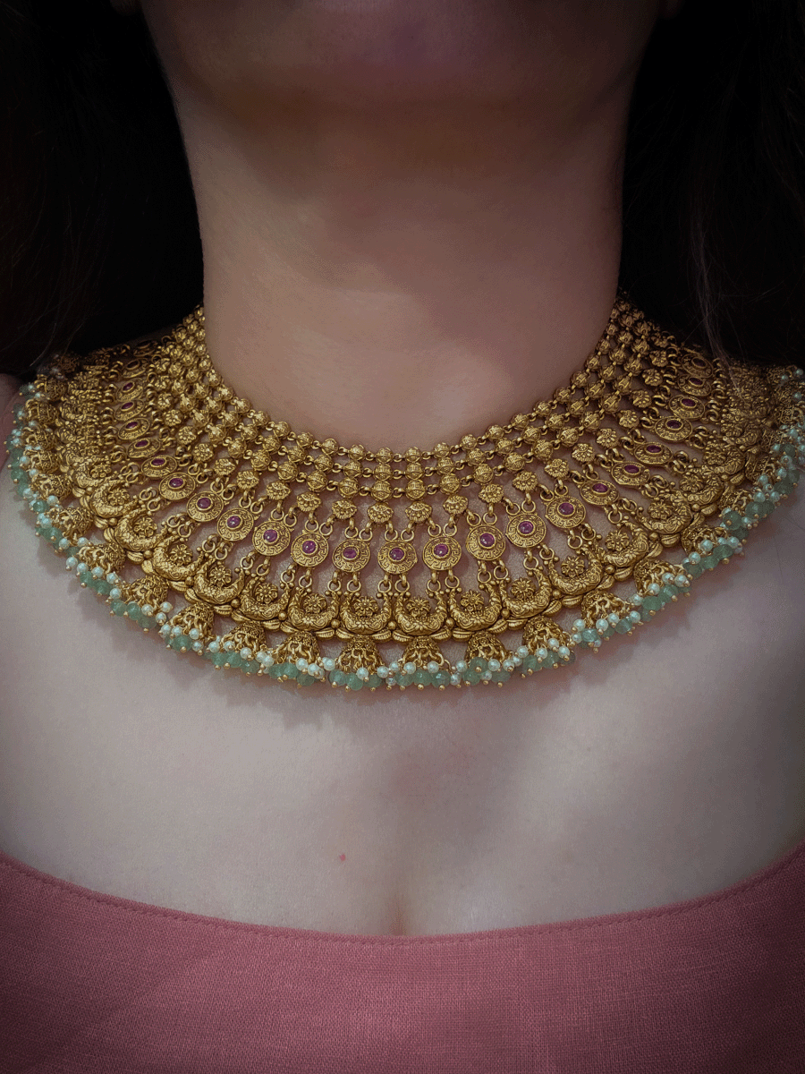 Broad choker set with circular tukdies and half jhoomki aqua bead design