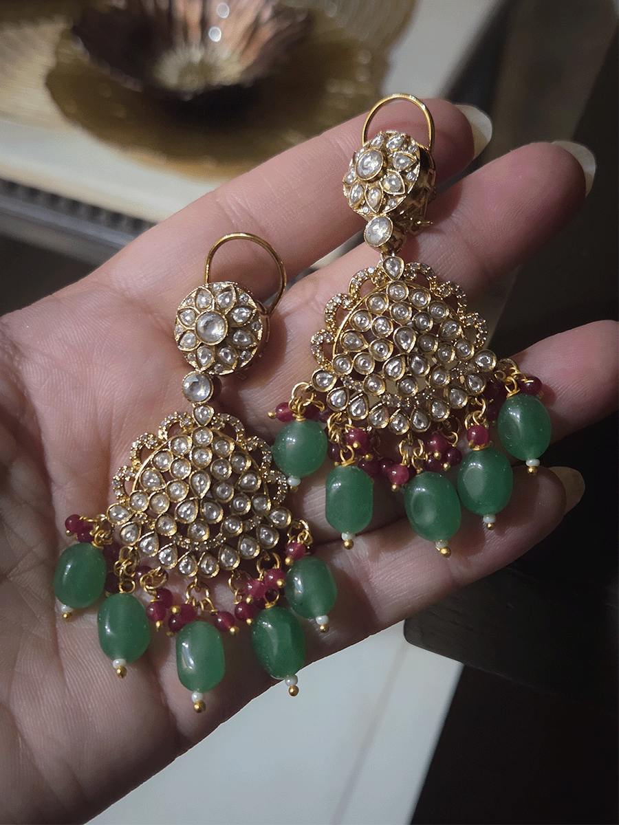 Leaf shaped kundan studded center with green enamel and bold center pendant set