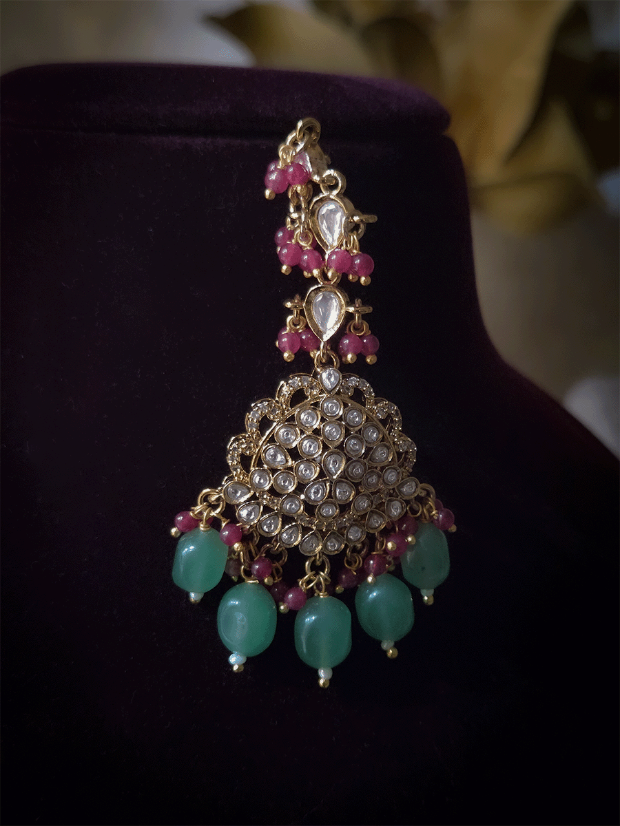 Leaf shaped kundan studded center with green enamel and bold center pendant set