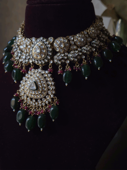 Leaf shaped kundan studded center with green enamel and bold center pendant set