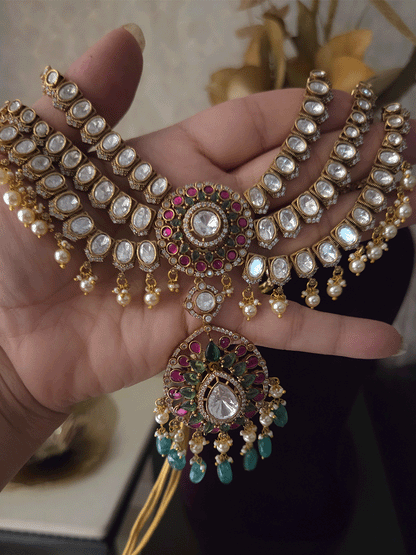 Triple layer moissanite strings set with ruby green circular tukdi in center and aqua drops leaf shaped hanging pendant