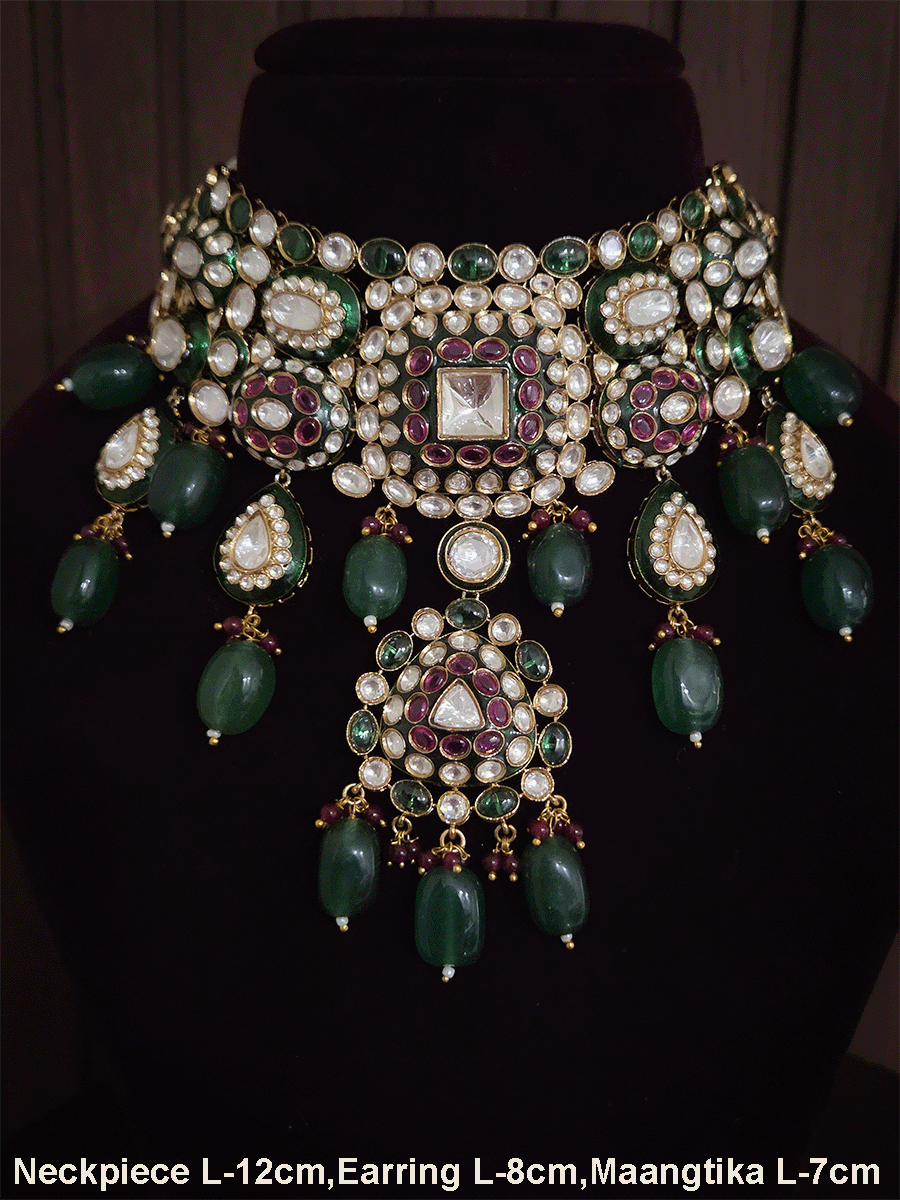 Green and ruby stones studded uncut polki broad set with big leaf shaped tukdi in center and four tear drop tukdies on sides
