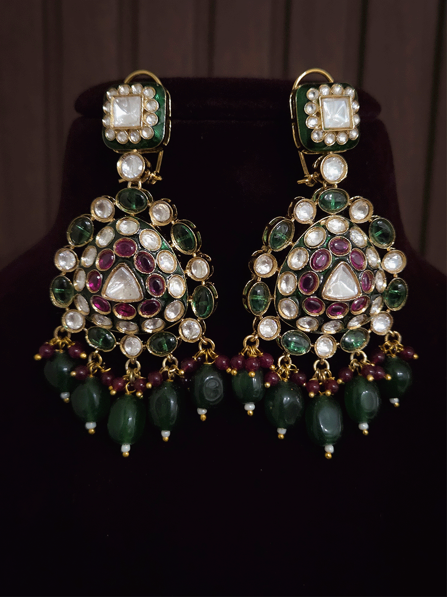 Green and ruby stones studded uncut polki broad set with big leaf shaped tukdi in center and four tear drop tukdies on sides