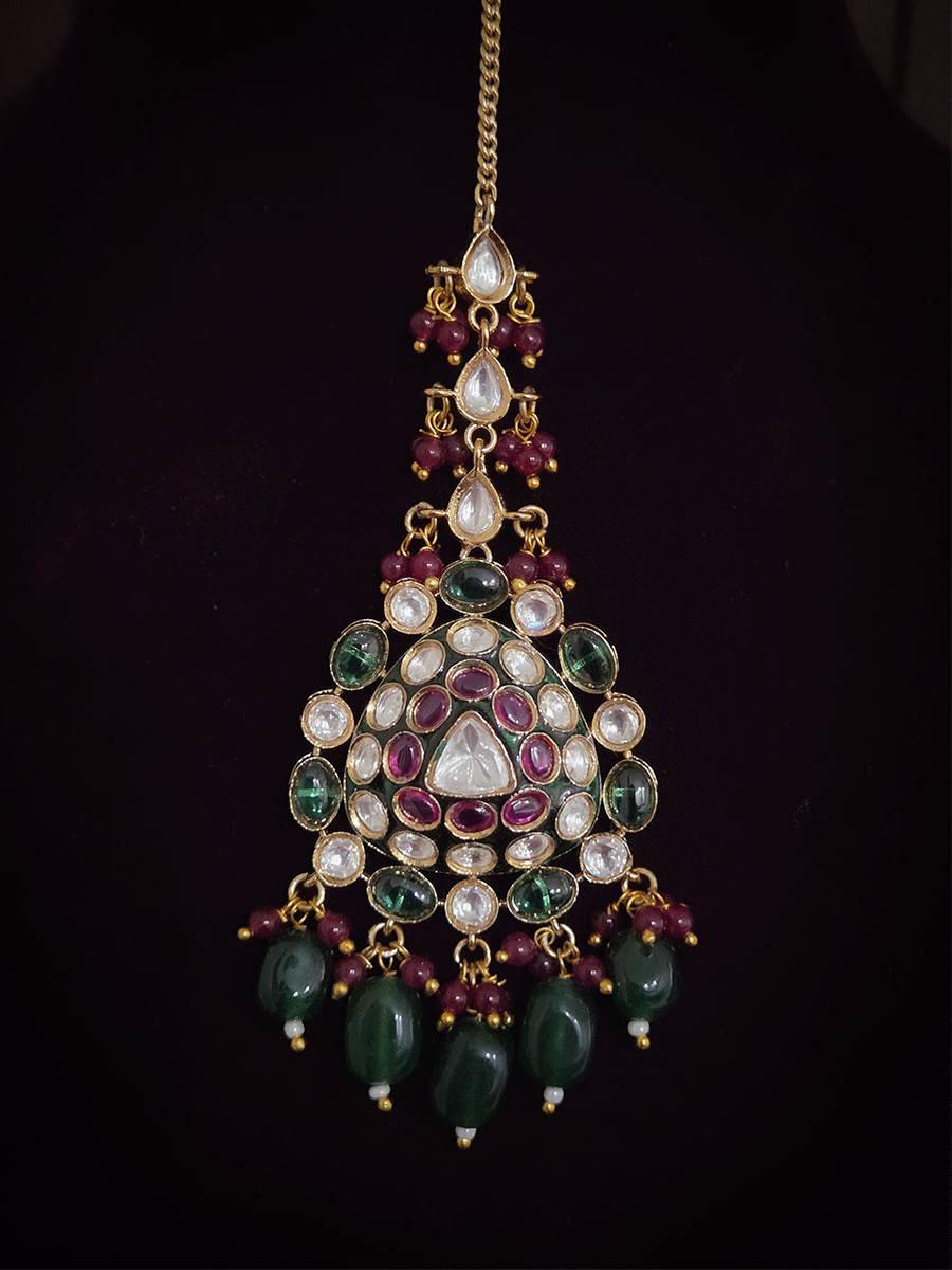 Green and ruby stones studded uncut polki broad set with big leaf shaped tukdi in center and four tear drop tukdies on sides