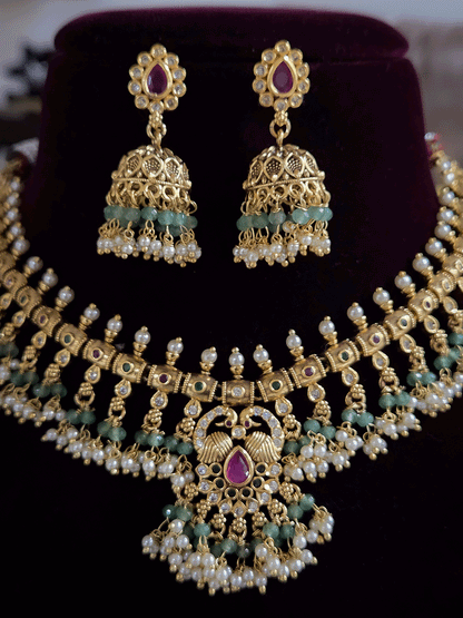 Tear drop ruby stone with peacock top design polki studded bead frill set