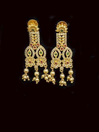 Intricate leaf and flower polki ruby and green stones choker set