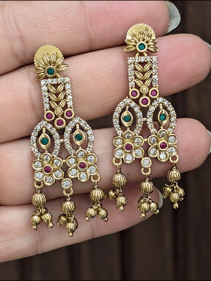 Intricate leaf and flower polki ruby and green stones choker set