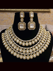 Classy triple layer oval kundan tukdies with AD outline set