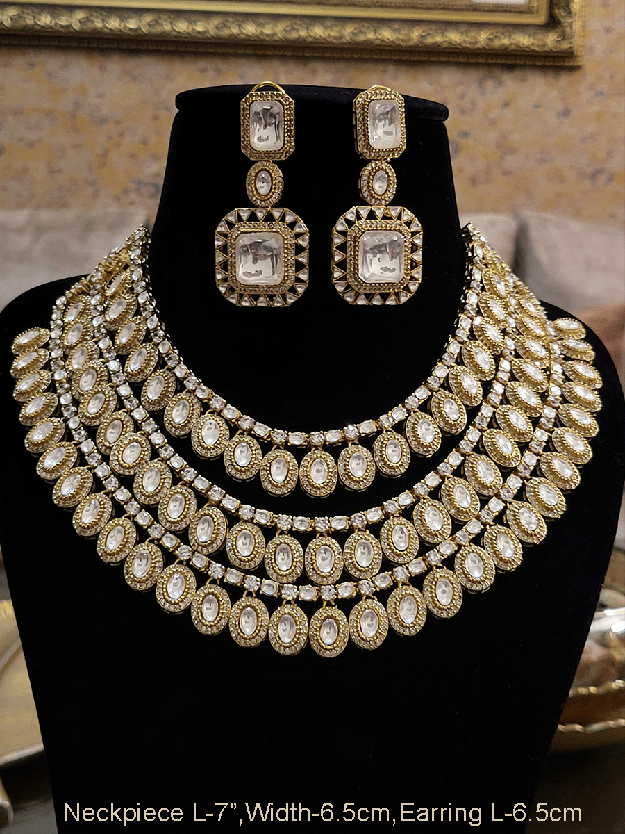 Classy triple layer oval kundan tukdies with AD outline set