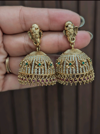 Ganpatiji motif's on top of AD studded choker with ruby and green stones flower