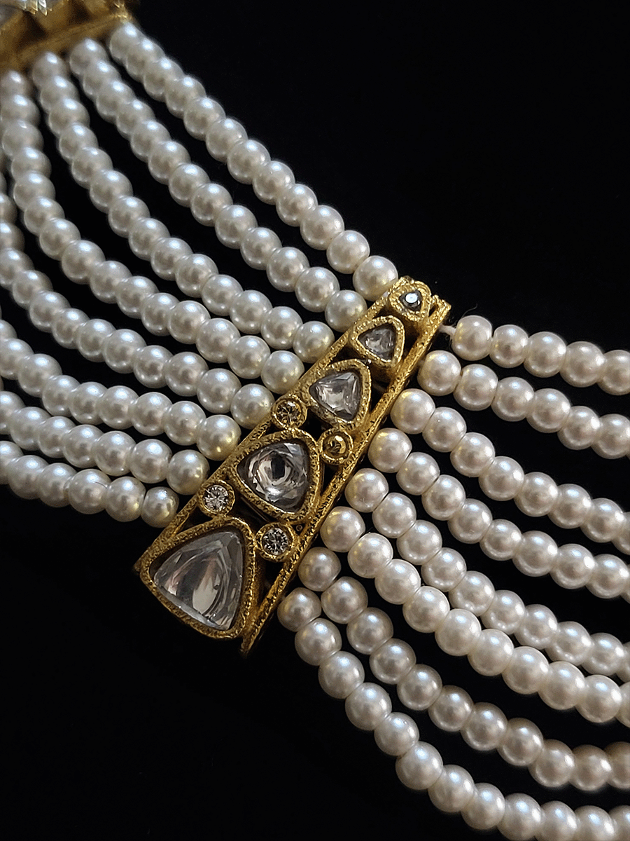 Eight pearl strings necklace set witk kundan tukdies in between