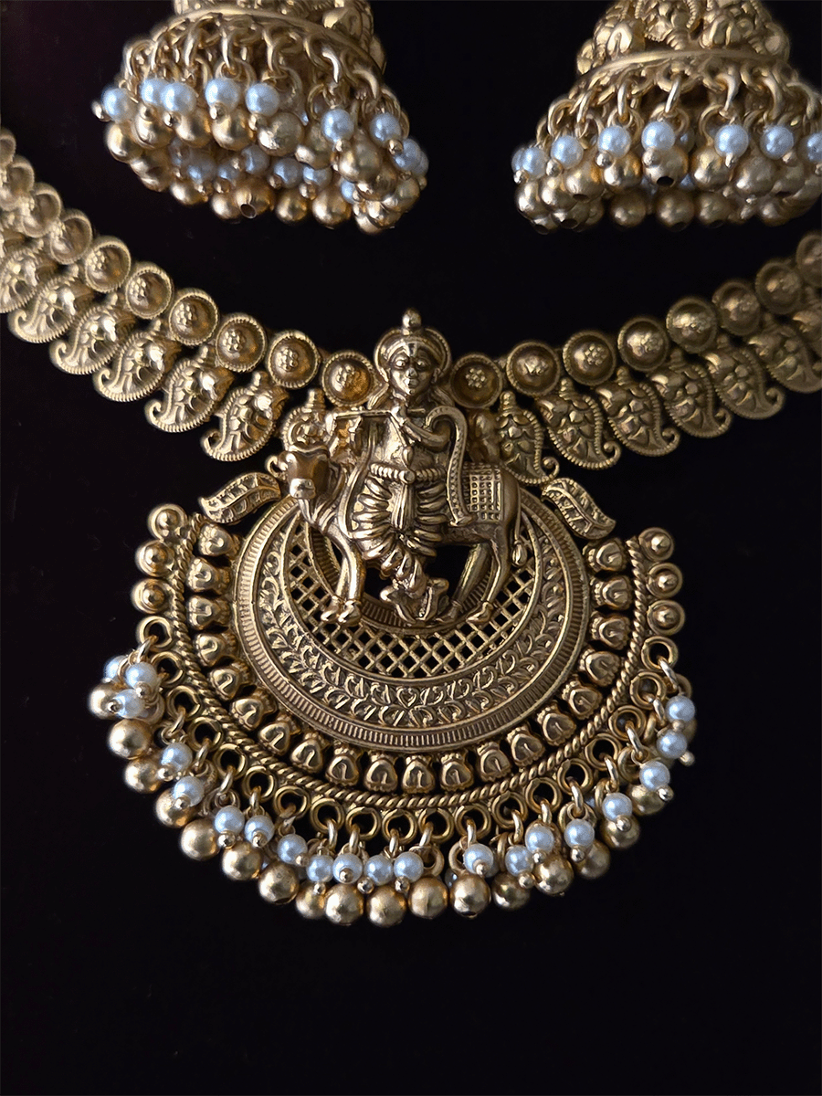 Krishnaji with cow motif on mesh design center necklace set with paisley design side chain