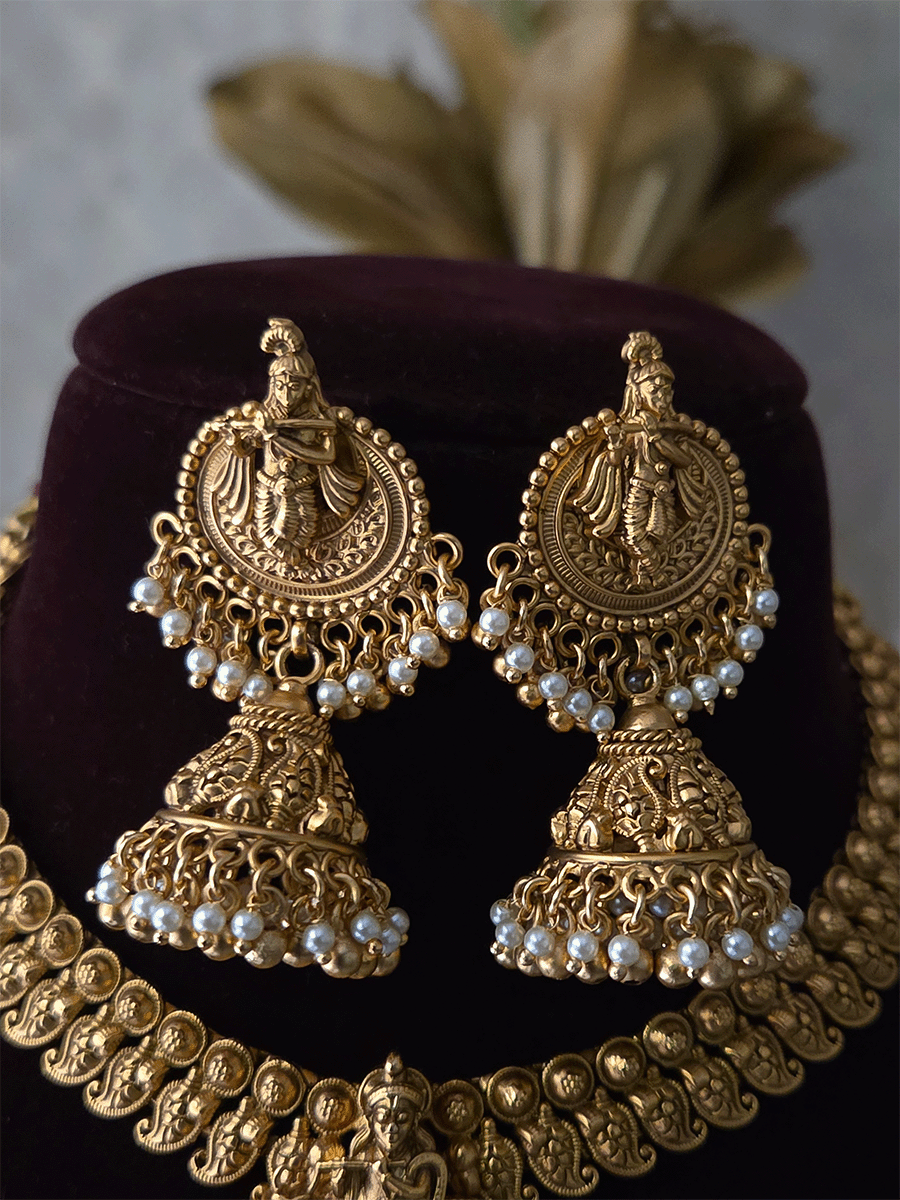 Krishnaji with cow motif on mesh design center necklace set with paisley design side chain