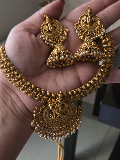 Krishnaji with cow motif on mesh design center necklace set with paisley design side chain