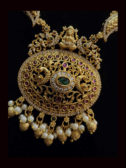 Oval zircon,ruby and green stone peacock design set with peacock design string
