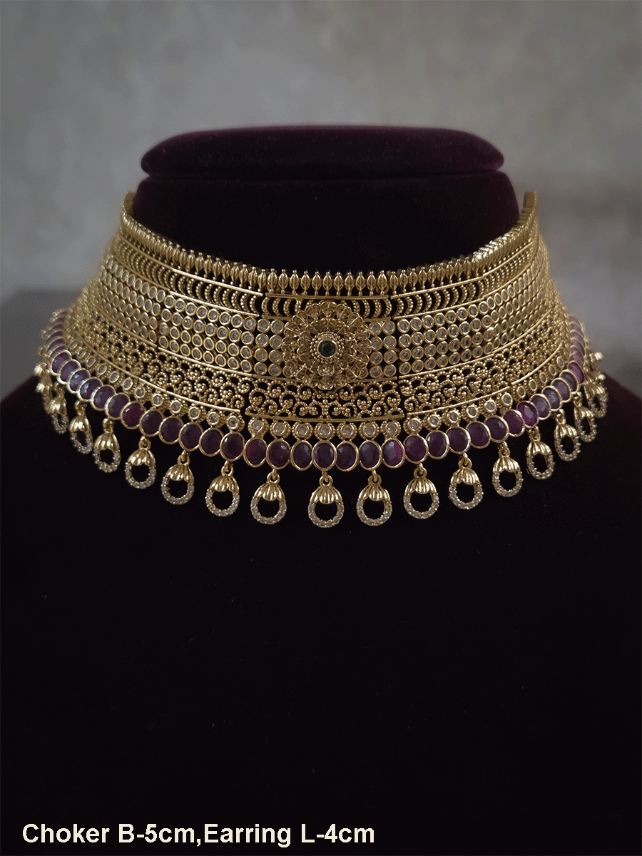 5cm broad flower center polki studded choker with oval ruby stones line and zircon loop hangings