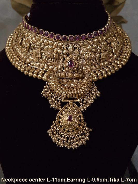 Ruby stone top line of 11cm broad choker set with nrityangna's and elephants and leaf shaped hanging tukdi in center
