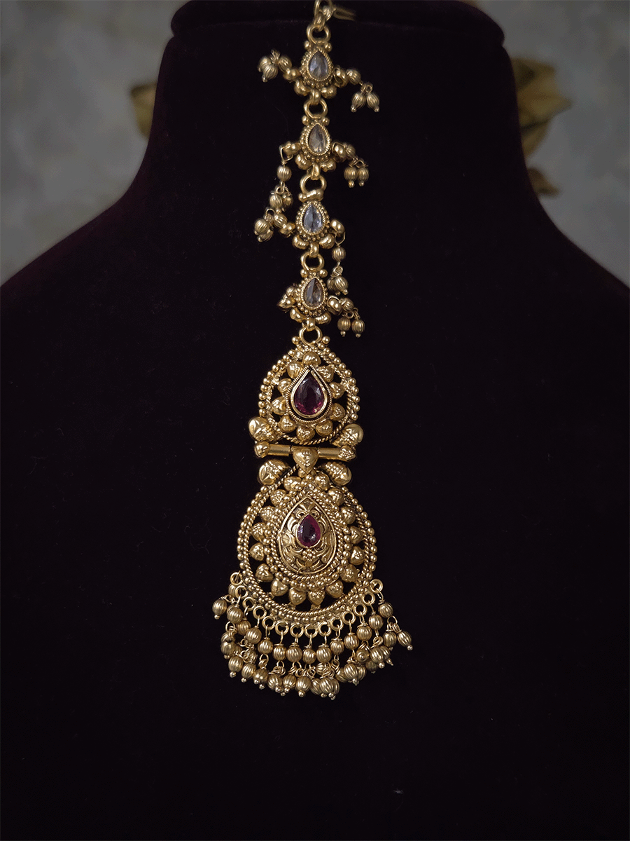 Ruby stone top line of 11cm broad choker set with nrityangna's and elephants and leaf shaped hanging tukdi in center