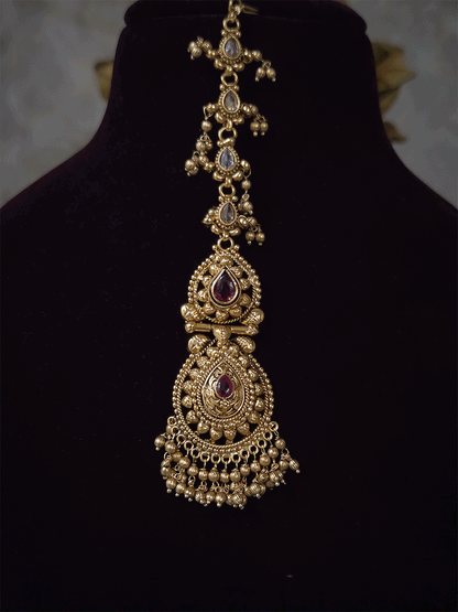 Ruby stone top line of 11cm broad choker set with nrityangna's and elephants and leaf shaped hanging tukdi in center
