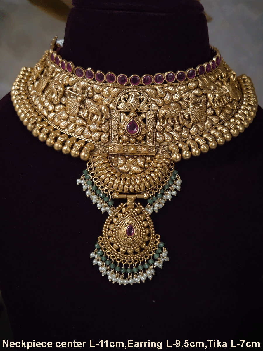 Ruby stone top line of 11cm broad choker set with nrityangna's and elephants and leaf shaped hanging tukdi in center