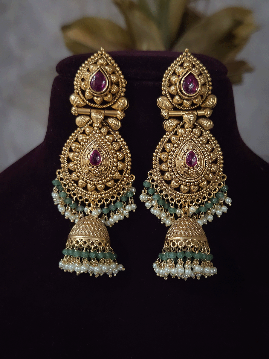 Ruby stone top line of 11cm broad choker set with nrityangna's and elephants and leaf shaped hanging tukdi in center